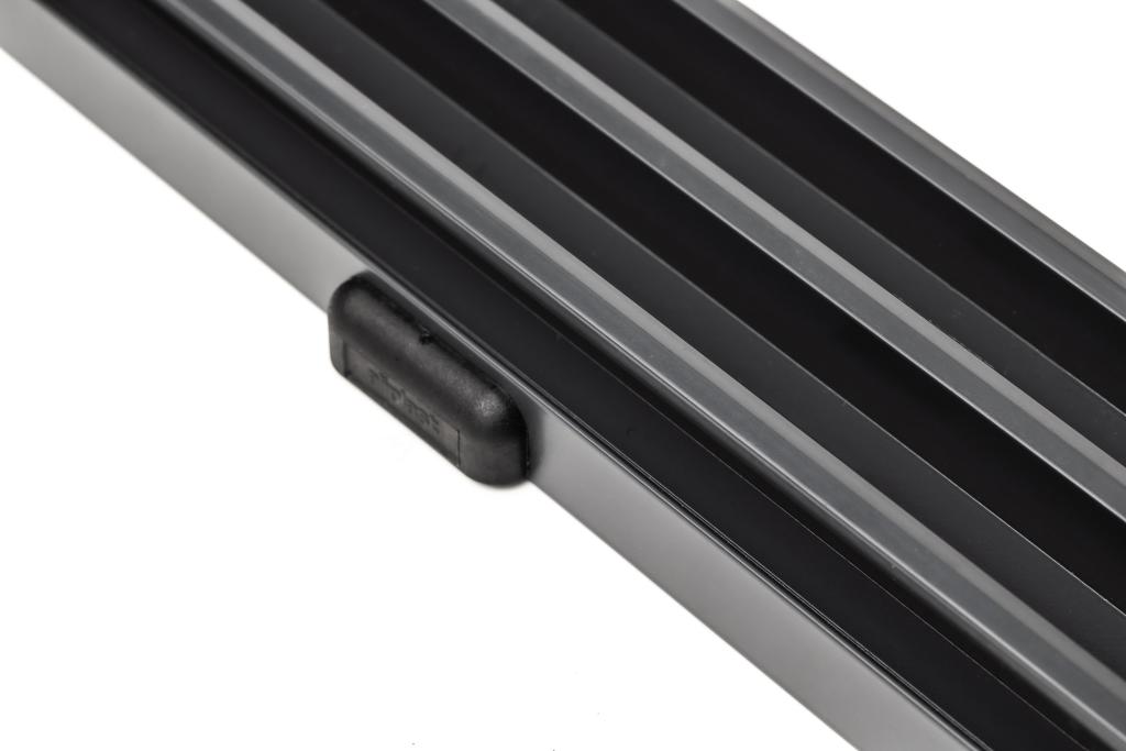 Self-draining bottom rail with hidden drainage channel.