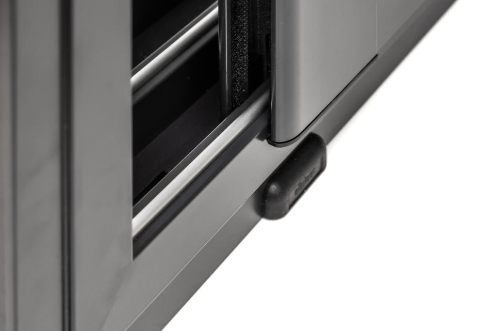 Self-draining bottom rail with hidden drainage channel.