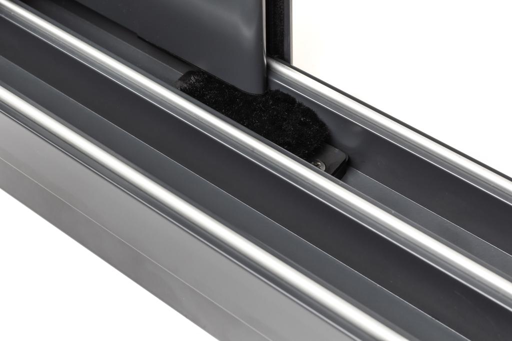 Brush gaskets in the top and bottom rails create a seal between the door leaves.